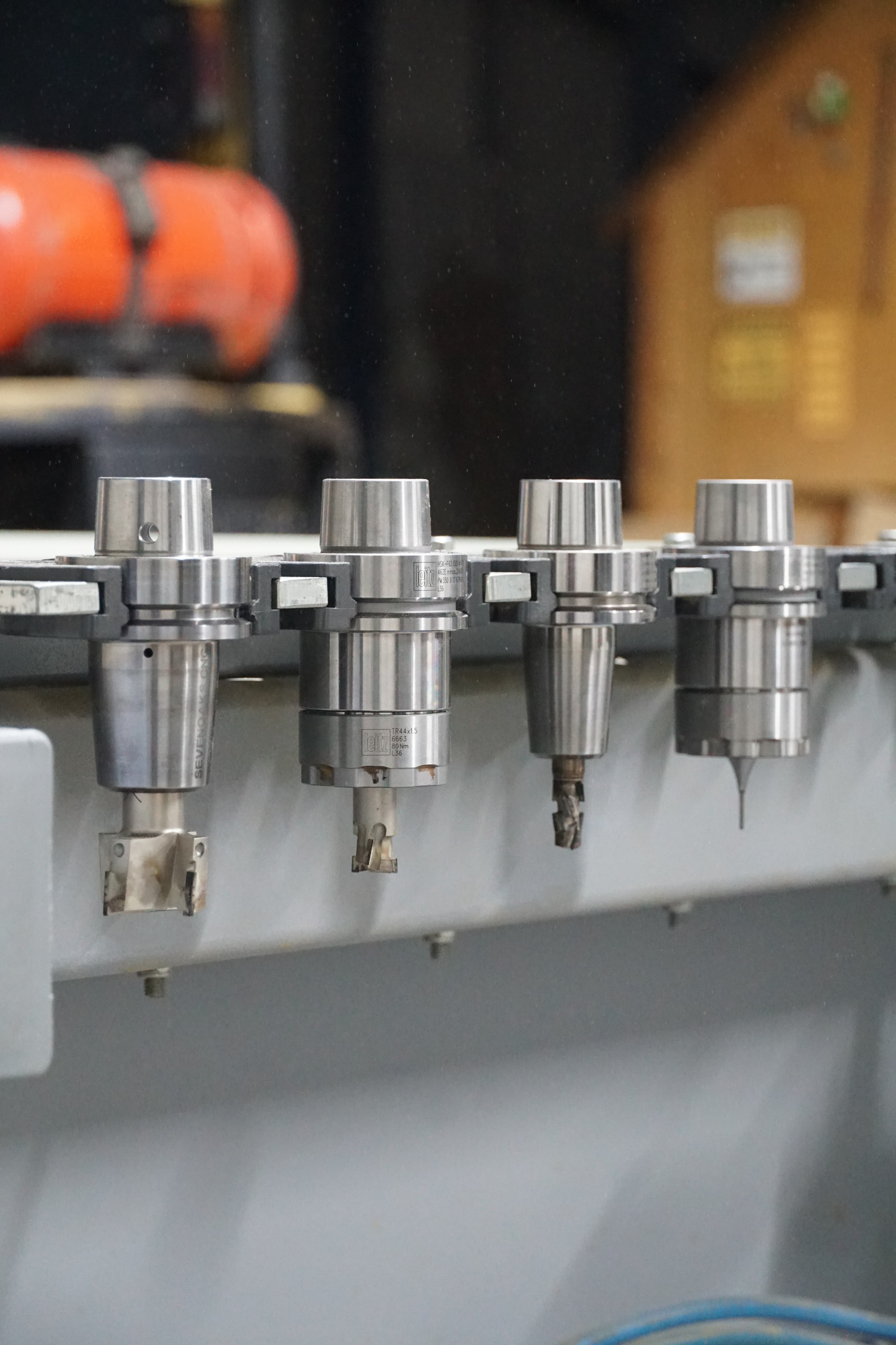 A multi-panel door on our CNC bed, showing the crisp, square internal corners machined into each panel field